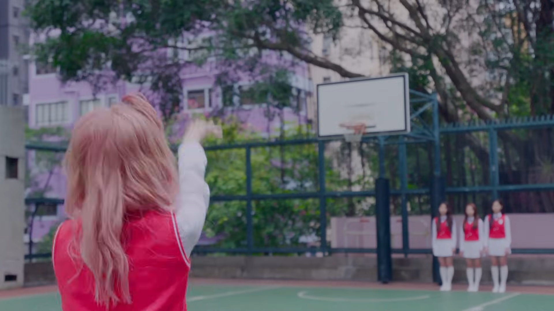 Vivi throwing a basketball.